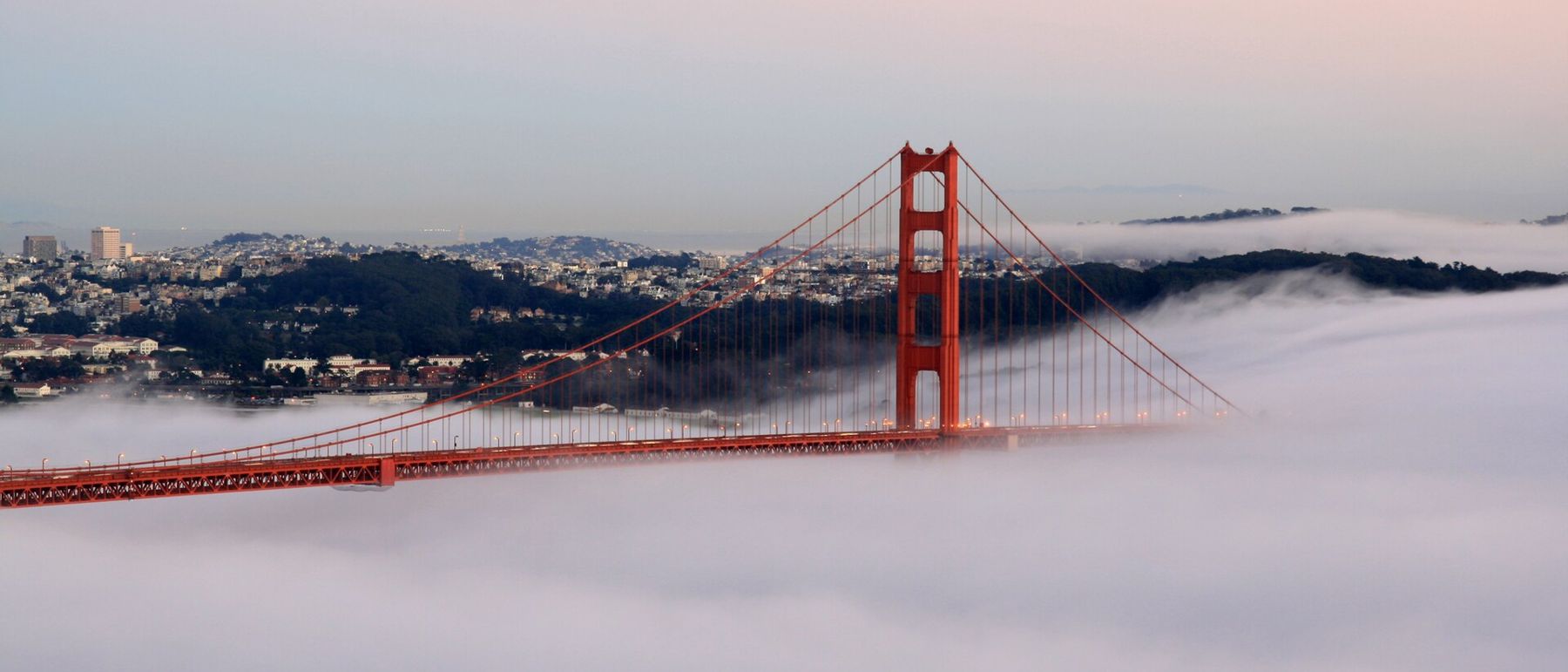 The Golden Gate Bridge at sunset with fog, San Francisco Bay Area